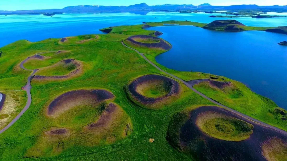 Green moss over broken lava beside Lake Myvatn on a guided Myvatn Lake and Godafoss waterfall tour, Iceland
